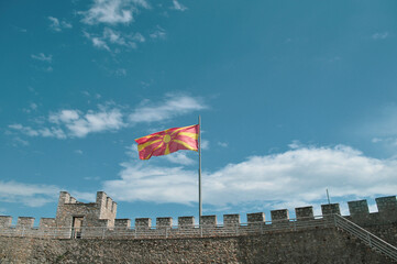 Castle walls, view of Samuil's Fortress, Unesco World Heritage Site, on Lake Ohrid, Ohrid town. View from watchtower of famous old fortress ruins of king Samuel. Macedonian flag on the top.