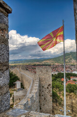 Castle walls, view of Samuil's Fortress, Unesco World Heritage Site, on Lake Ohrid, Ohrid town. View from watchtower of famous old fortress ruins of king Samuel. Macedonian flag on the top.
