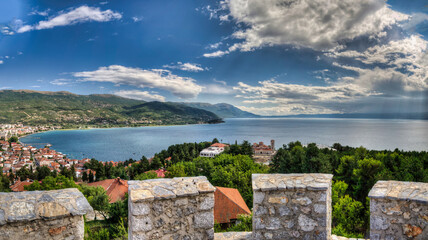 Castle walls, view of Samuil's Fortress, Unesco World Heritage Site, on Lake Ohrid, Ohrid town. View from watchtower of famous old fortress ruins of king Samuel. Clouds over the Lake and blue water.