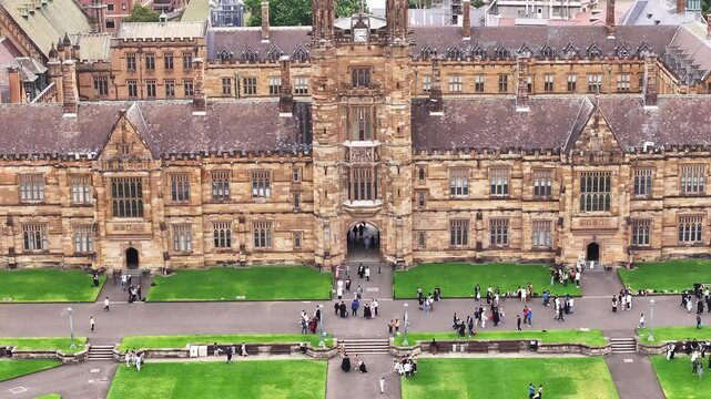 University of Sydney revealing aerial drone shot flying backwards unique view.