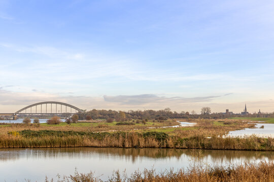 Skyline Culemborg with the Kuilenburg Railway Bridge and the Goilberdingerwaard and the river Lek.