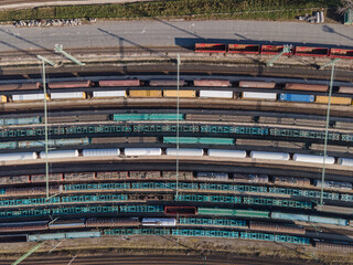 Aerial view of cargo trains in a freight yard
