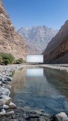 A white, empty canvas on an easel floats on calm water, surrounded by stunning high desert mountains under a bright blue sky