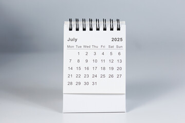 Minimalistic photo of a desk calendar displaying February 2025. Clean and professional design, suitable for topics like planning, organization, and productivity.