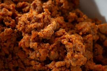 A closeup view of a taco style ground chicken.