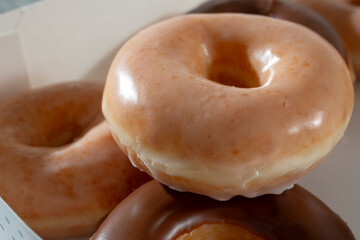 A view of a pile of glazed donuts.