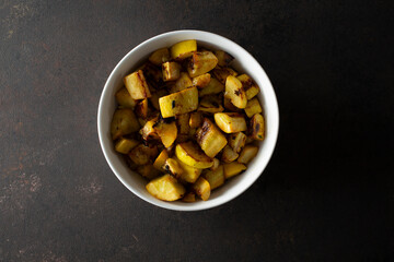 A top down view of a bowl of sauteed yellow squash.