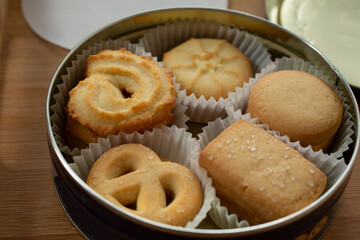 A closeup view of a blue tin of Danish butter cookies.
