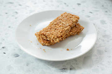 A view of a plate of crunchy granola bars.