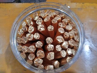 Unfiltered clove cigarettes without gold color packaging in a jar