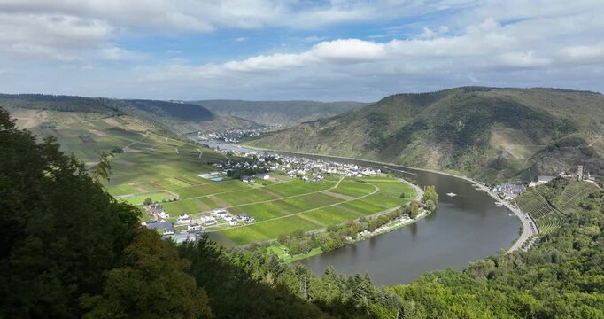 Aerial drone video seen from a panoramic viewpoint overlooking the valley in the town of Beilstein on the Moselle river in the German state of Rhineland Palatinate.
