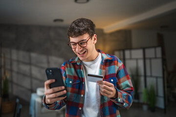 yong man buy online with credit card and mobile phone at home