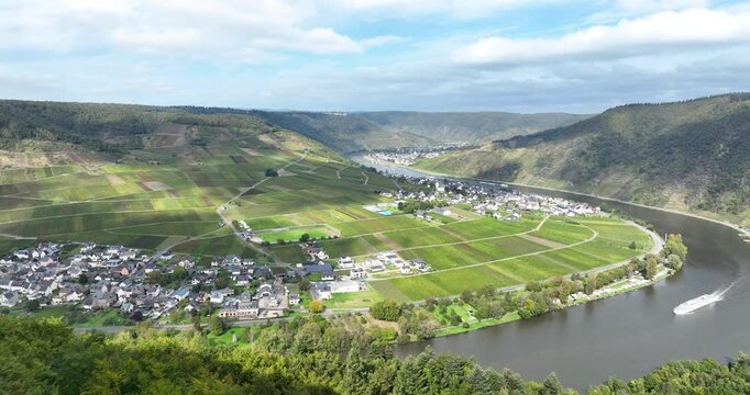 Aerial drone video seen from a panoramic viewpoint overlooking the valley in the town of Beilstein on the Moselle river in the German state of Rhineland Palatinate.
