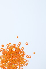 Beautiful orange confetti on a white background