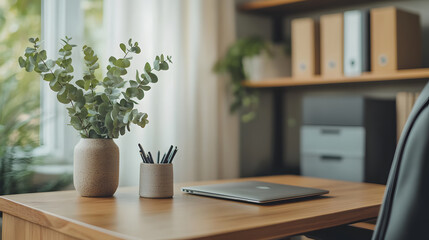 Bright and minimalistic workspace with greenery and modern accessories