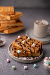 photo Indulge in Irresistible Sweet Waffle Delight: Decadent Chocolate Drizzle with Fluffy Marshmallows and Creamy Coffee for Ultimate Cozy Breakfast Enjoyment