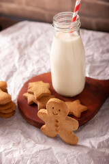 Homemade gingerbread man cookies and milk, traditionally made at Christmas and the holidays.