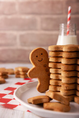 Homemade gingerbread man cookies and milk, traditionally made at Christmas and the holidays.