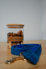 A glass jar with a wooden lid labeled 