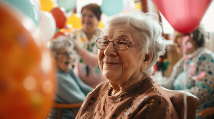 Obraz premium Joyful Retirement Home Celebration with Elderly Residents and Festive Decorations