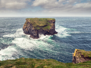 Kilkee cliff in county Clare, Ireland. Popular travel area with stunning nature scenery with green...