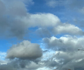 blue sky with clouds and trees