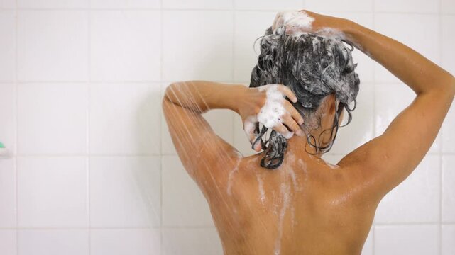 Attractive Latino woman taking her morning shower.