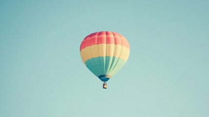 Naklejka premium Colorful hot air balloon in flight, minimalist style, white background, central composition, vibrant colors