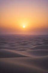 Fototapeta premium Golden Dawn: The Majesty of a Sunrise Across Endless White Sands