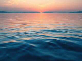 Obraz premium A beautiful blue watercolor wash is applied to the surface of a calm lake at sunset, creating a stunning splash effect, warm colors., water effects, peaceful scene, lake sunsets