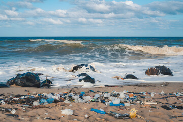 Polluted Beach Waves crash onto a litter strewn shore, raising awareness about environmental pollution