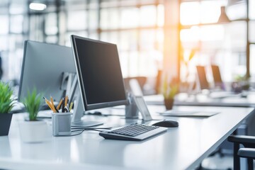 Modern Office Workspace with Computers and Green Plants, Bright and Spacious Environment, Focus on Minimalist Design and Productivity Enhancements