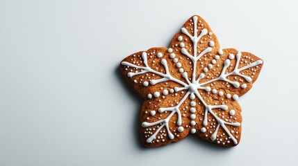 Fototapeta premium Delicious Christmas star cookie with sugar icing and tiny festive details, minimalistic white backdrop, high contrast, optimized for holiday advertising