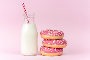 Strawberry donuts with sprinkles and a bottle of milk on pink background. Unhealthy breakfast.






STRAWBERRY DONUTS WITH SPRINKLES AND A BOTTLE OF MILK ON PINK BACKGROUND. UNHEALTHY BREAKFAST.