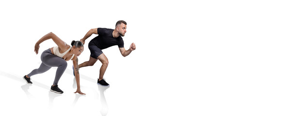 Two athletes, a woman and a man, are in an intense starting position, ready to sprint. They display determination and focus as they prepare for a fast race.