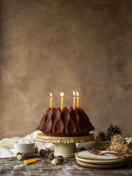 Christmas cake with candles on top. Rustic Mood and christmas decoration