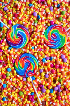 Lollipops and candy with modern color blocking aesthetic.