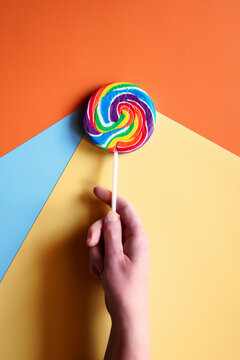 Lollipop with modern color blocking aesthetic.