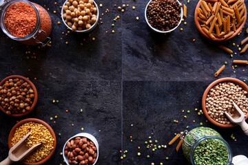 Selection of dried and canned legumes, and pasta made from legumes for plant-based whole food diet.