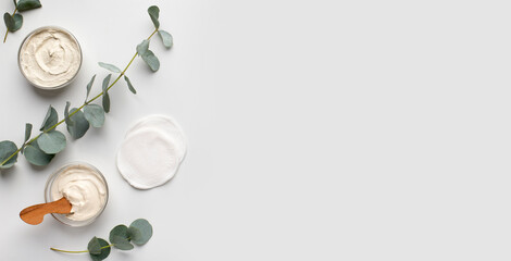 Homemade natural cosmetics. Organic creams with olive oil for face and body, white background, panorama, copy space