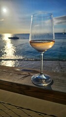 glass of wine on the beach