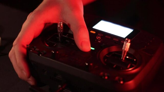 Close-up of Pilot Turning On FPV Drone Controller