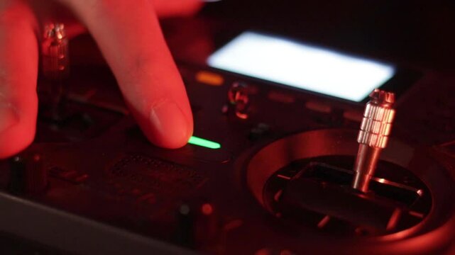 Close-up of Pilot Activating FPV Drone Controller