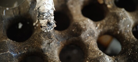 cigarette ash in the ashtray