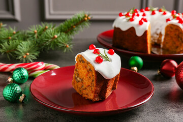Traditional classic Christmas cake and decor on gray textured table