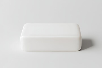 A white bar of soap sits on a white countertop, the perfect form of soap