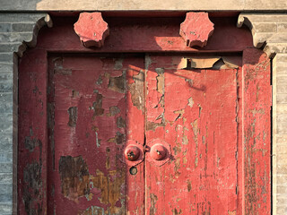 Red color ancient old door in China.