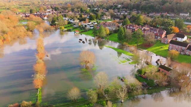Aerial shot showing flooded fields and gardens of residential properties when the River Avon burst its banks after the heavy rain of Storm Bert.