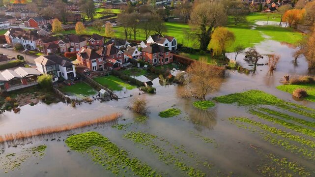 Aerial shot showing flooded fields and gardens of residential properties when the River Avon burst its banks after the heavy rain of Storm Bert.