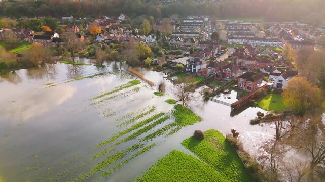 Aerial shot showing flooded fields and gardens of residential properties when the River Avon burst its banks after the heavy rain of Storm Bert.